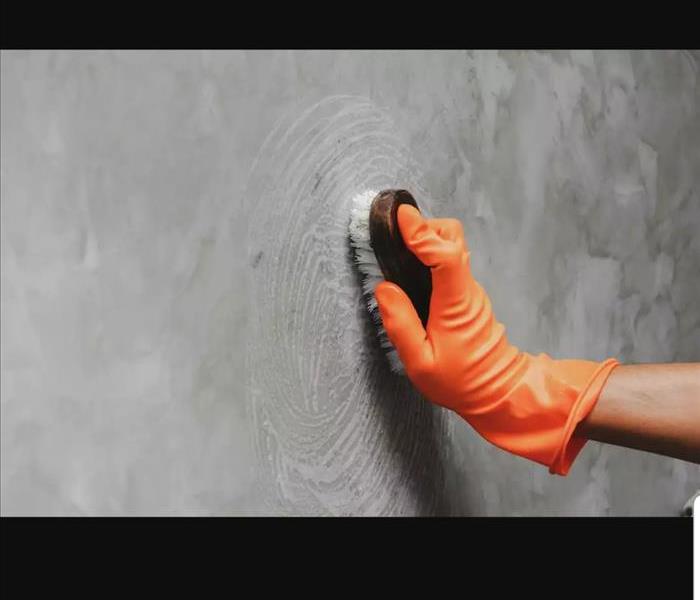 Wiping Soot Off Of A Wall