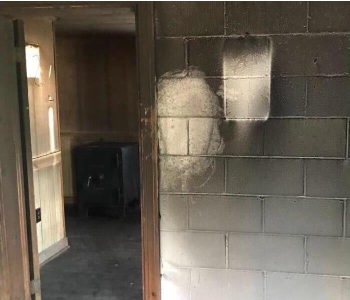 White walls of local business damaged with smoke and soot damage