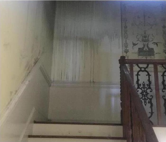 Smoke and soot damage on walls after a fire. 
